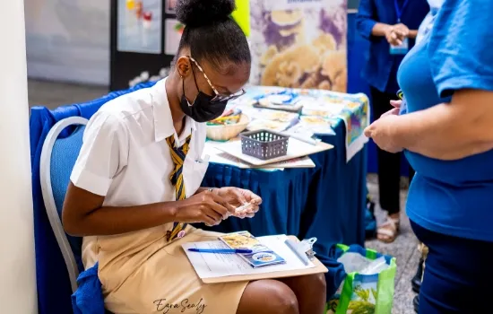 Student sitting and filling out form